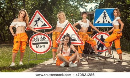 stock-photo-five-women-in-orange-overalls-are-mounting-no-men-signs-on-the-road-470821286.jpg