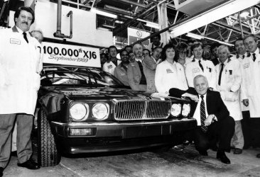 John-Egan-with-the-100000th-XJ6-off-the-production-line-surrounded-by-assembly-workers-in-1989.jpg