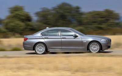 2011-bmw-5-series-side-driving.jpg